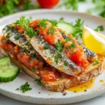 How to eat canned sardines in tomato sauce with crusty bread and fresh garnishes