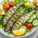 What do you serve with sardines? Fresh salad, bread, and vibrant toppings on a white marble table