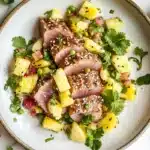 Do tuna and pineapple go together? A delicious plated dish with seared tuna and fresh pineapple salsa on a modern white plate